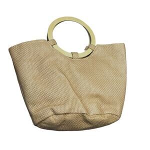 Straw tote with wooden circle handles interior is fabric lined